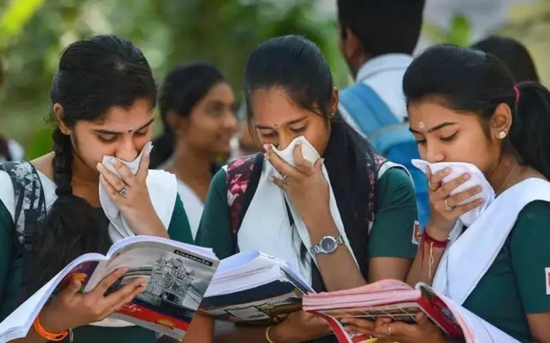 student studying from book